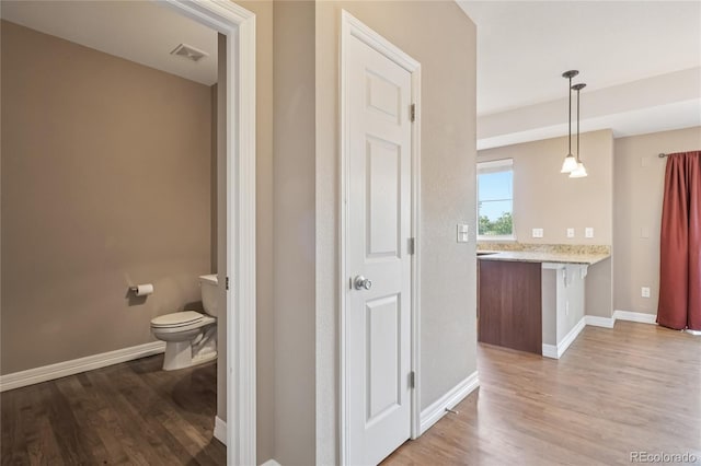 12921 Grant Cir Unit B, Thornton, CO 80241 - bathroom with wood finished floors and vanity