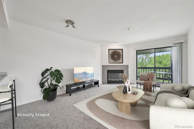 2727 Folsom St Unit 303, Boulder, CO 80304 - living area featuring a tile fireplace and carpet