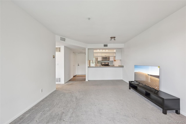 2727 Folsom St Unit 303, Boulder, CO 80304 - unfurnished living room with carpet flooring and baseboards