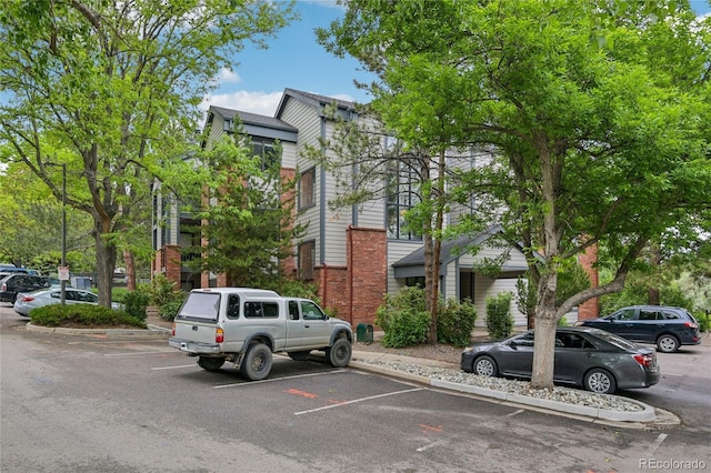 2727 Folsom St Unit 303, Boulder, CO 80304 - view of front of home featuring uncovered parking and brick siding