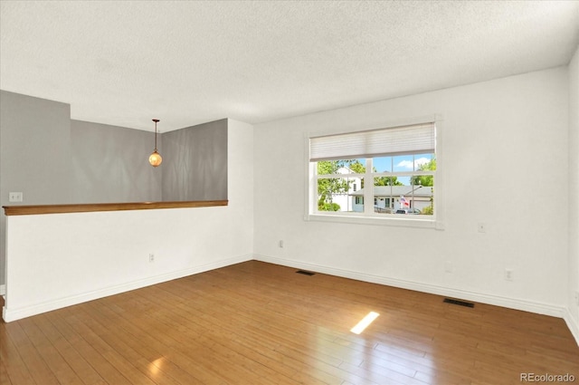 13496 Alcott Way, Broomfield, CO 80020 - empty room with hardwood / wood-style flooring, a textured ceiling, and baseboards
