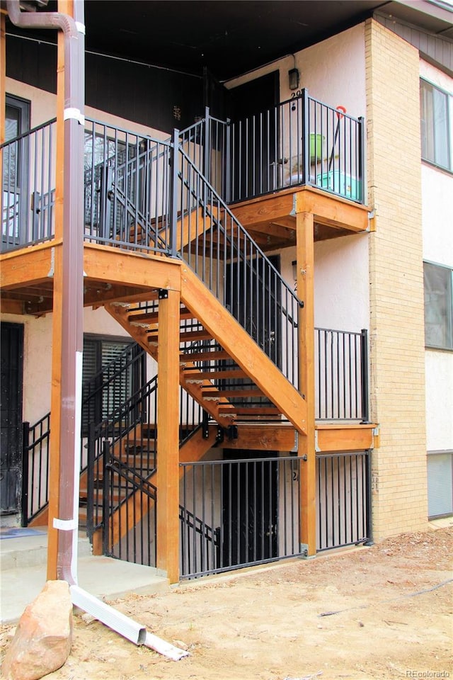 875 S Quebec St Unit 25, Denver, CO 80247 - doorway to property with stucco siding and brick siding