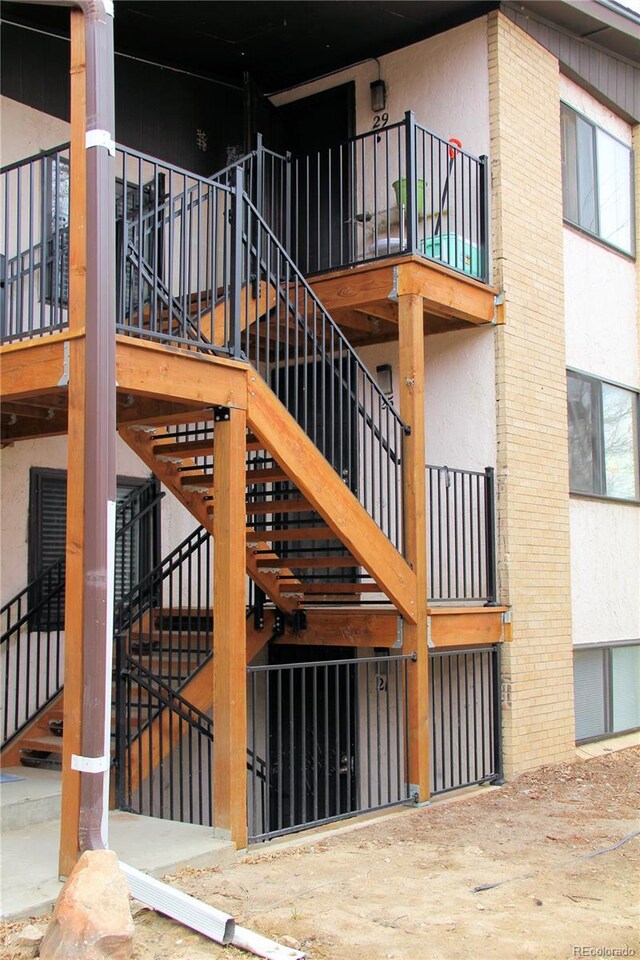 875 S Quebec St Unit 25, Denver, CO 80247 - doorway to property featuring stucco siding and brick siding