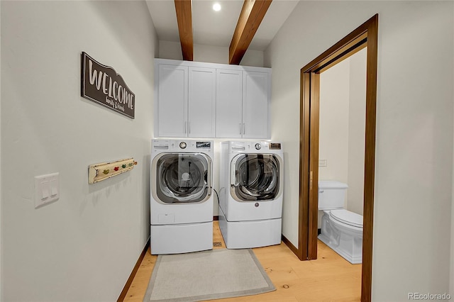 55 Blue Flag Dr, Breckenridge, CO 80424 - laundry room featuring cabinet space, light wood finished floors, and independent washer and dryer