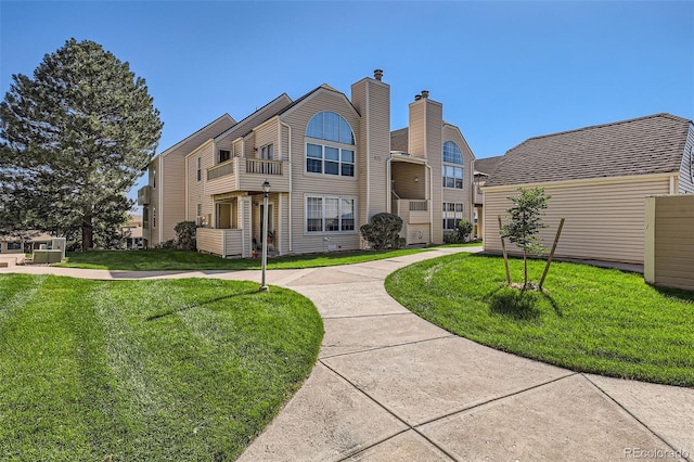 surrounding community featuring a lawn