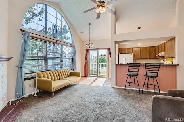 living room featuring high vaulted ceiling, carpet flooring, a textured ceiling, and ceiling fan with notable chandelier