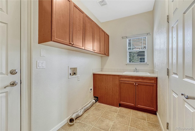 laundry room with hookup for a washing machine, visible vents, cabinet space, hookup for an electric dryer, and a sink