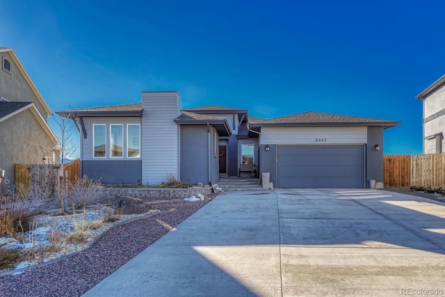 ranch-style house featuring a garage