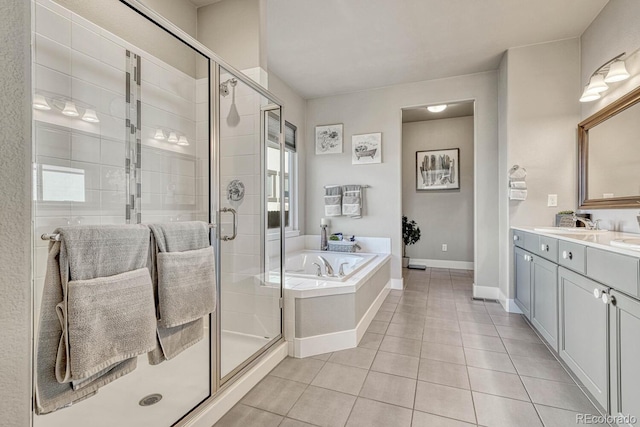 bathroom featuring vanity, tile patterned floors, plenty of natural light, and independent shower and bath