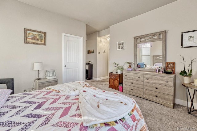 bedroom featuring light colored carpet