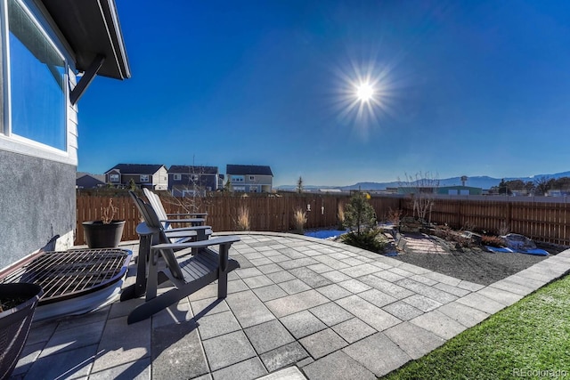 view of patio / terrace featuring a mountain view