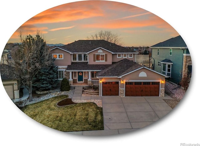 view of front of house with concrete driveway, an attached garage, covered porch, and stone siding