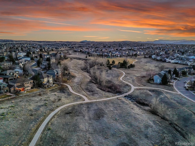 aerial view at dusk with a residential view and a mountain view