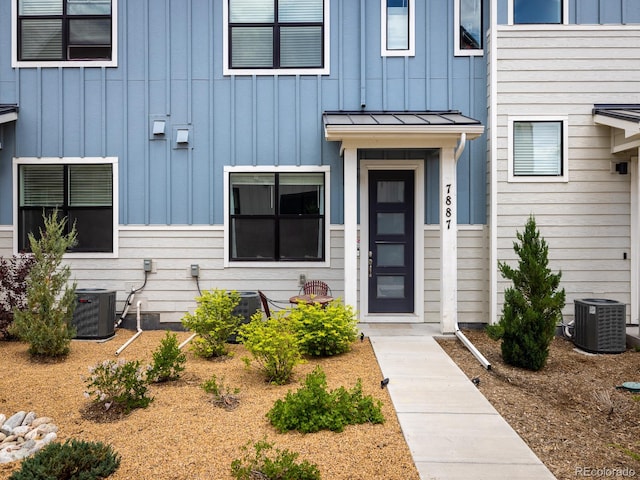 doorway to property with central air condition unit