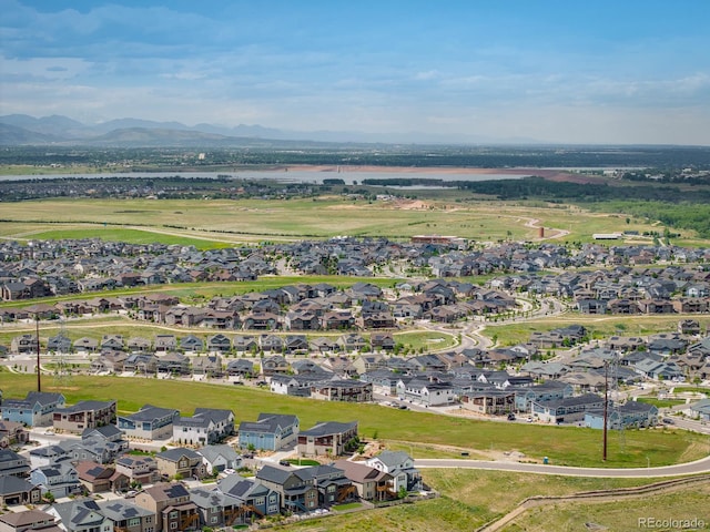 birds eye view of property with a mountain view