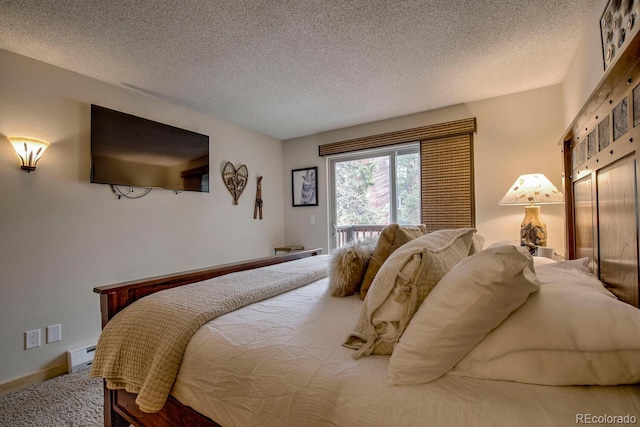 405 Four Oclock Rd Unit 15-A, Breckenridge, CO 80424 - bedroom featuring a textured ceiling and baseboard heating