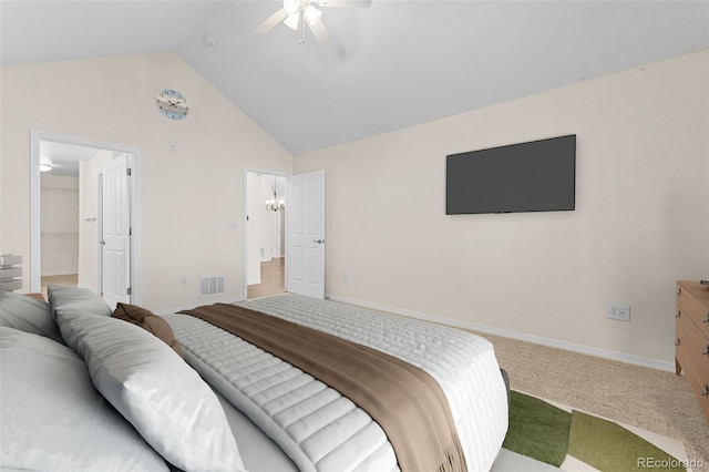 bedroom featuring ceiling fan, high vaulted ceiling, carpet floors, and a walk in closet