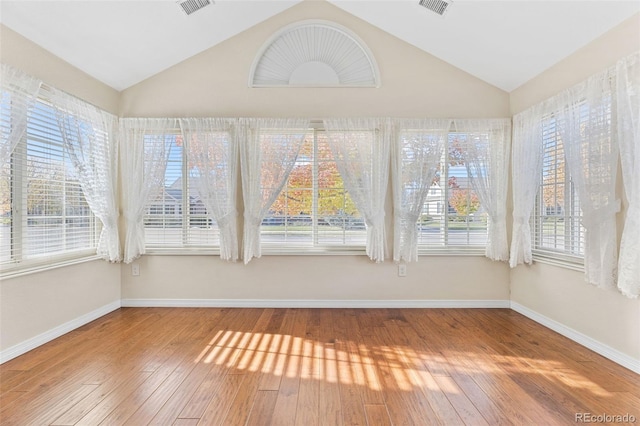 unfurnished sunroom with lofted ceiling and a healthy amount of sunlight