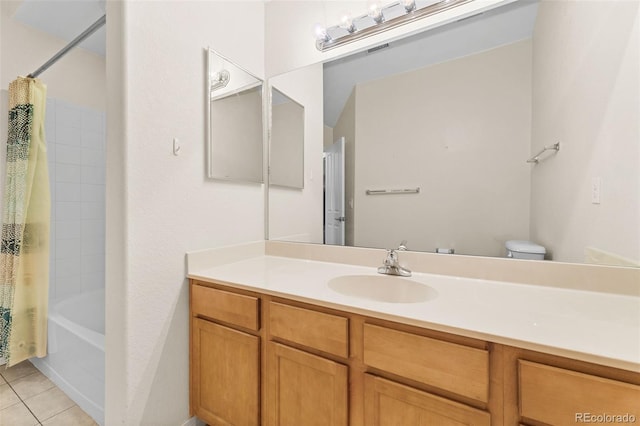 full bathroom with vanity, toilet, tile patterned floors, and shower / tub combo