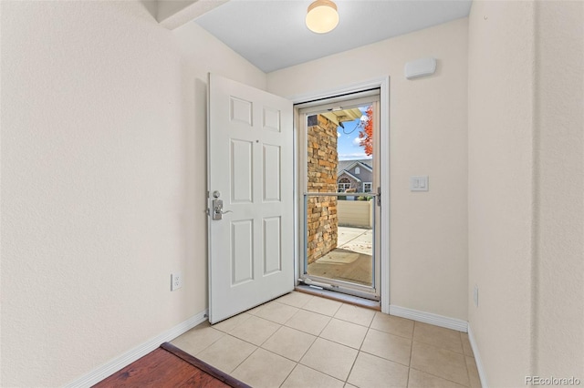 doorway featuring light tile patterned floors