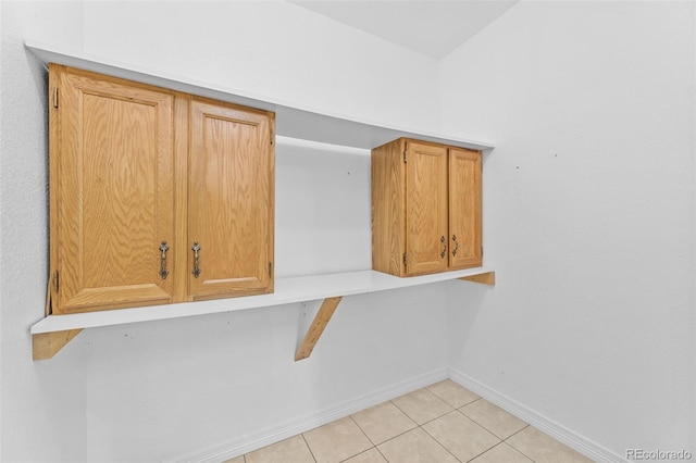 laundry area featuring light tile patterned flooring