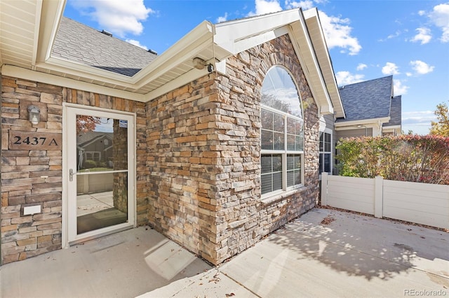 view of exterior entry featuring a patio