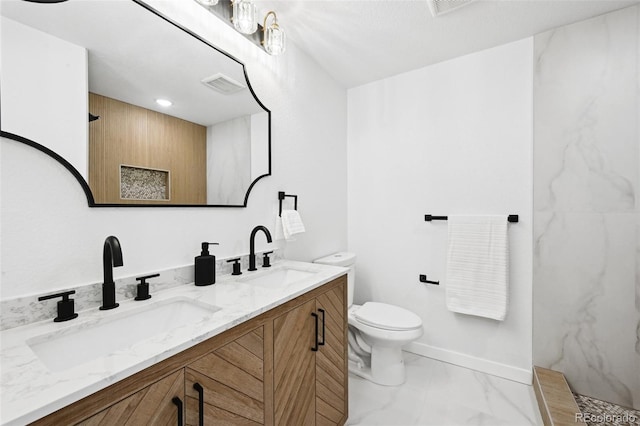 290 Beryl Way, Broomfield, CO 80020 - full bathroom featuring toilet, marble look tiles, a marble finish shower, double vanity, and baseboards