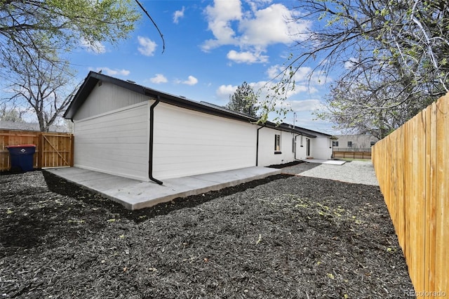 290 Beryl Way, Broomfield, CO 80020 - rear view of property featuring a fenced backyard and a patio area