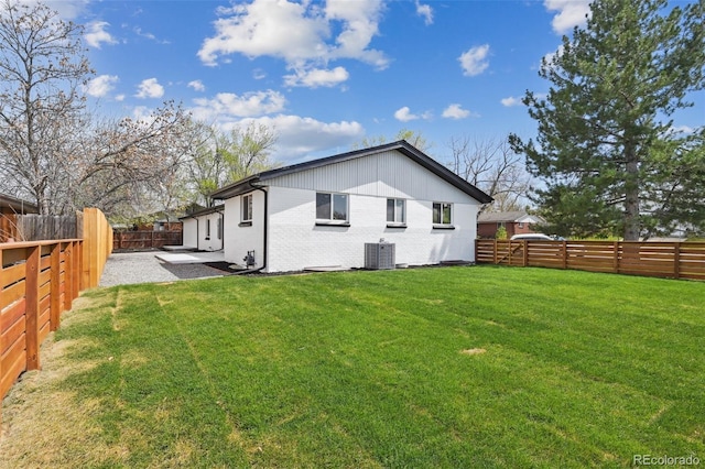 290 Beryl Way, Broomfield, CO 80020 - rear view of house featuring cooling unit, brick siding, and a patio area