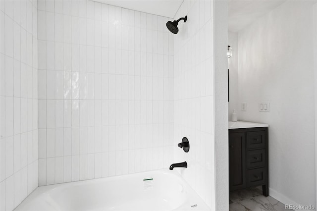 290 Beryl Way, Broomfield, CO 80020 - bathroom featuring vanity, bathing tub / shower combination, marble finish flooring, and baseboards
