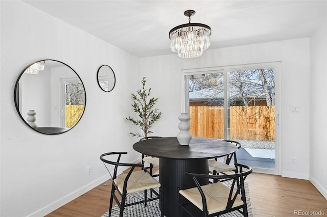 290 Beryl Way, Broomfield, CO 80020 - dining space with a chandelier, baseboards, and wood finished floors