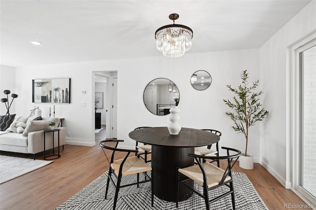 290 Beryl Way, Broomfield, CO 80020 - dining area featuring wood finished floors, baseboards, and a chandelier