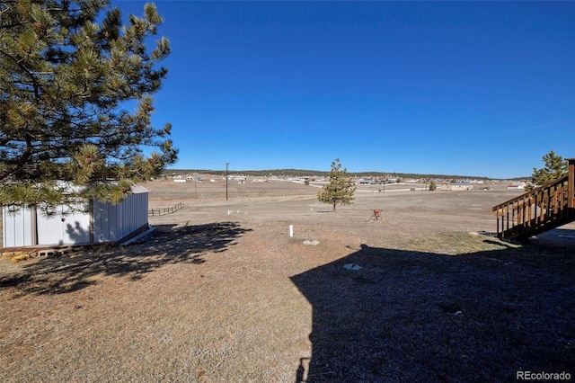 view of yard with a shed and an outdoor structure