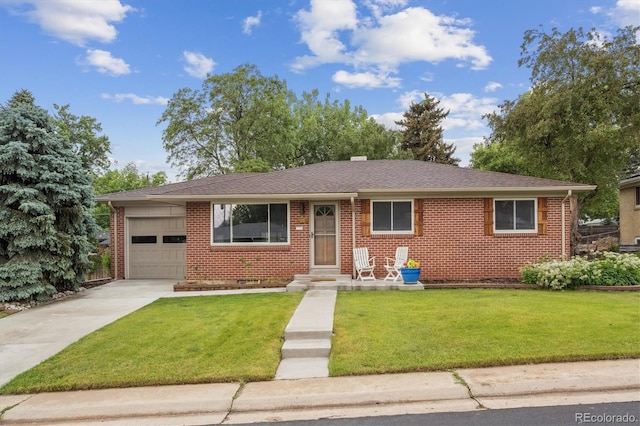 3384 W Arlington Ave, Littleton, CO 80123 - view of front of home featuring a garage, driveway, brick siding, a front yard, and a shingled roof