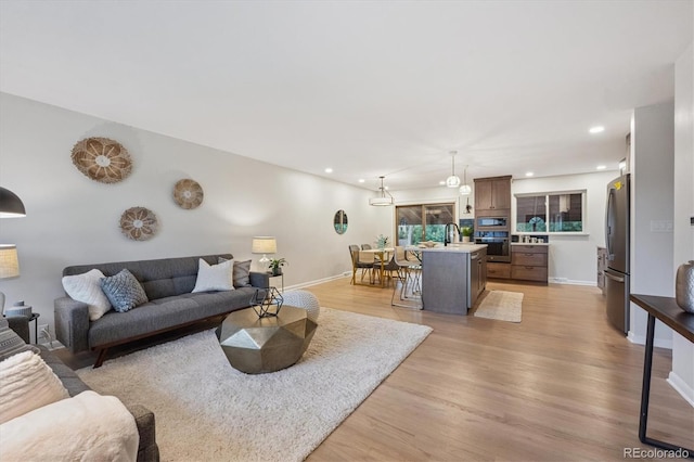 3384 W Arlington Ave, Littleton, CO 80123 - living room with light wood-style flooring and recessed lighting