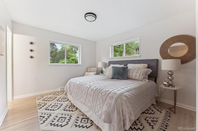 3384 W Arlington Ave, Littleton, CO 80123 - bedroom with light wood finished floors