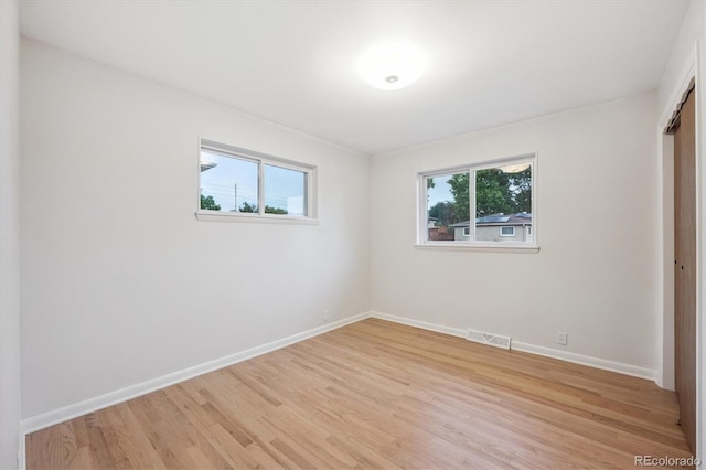 3384 W Arlington Ave, Littleton, CO 80123 - unfurnished bedroom featuring light wood-style floors and a closet