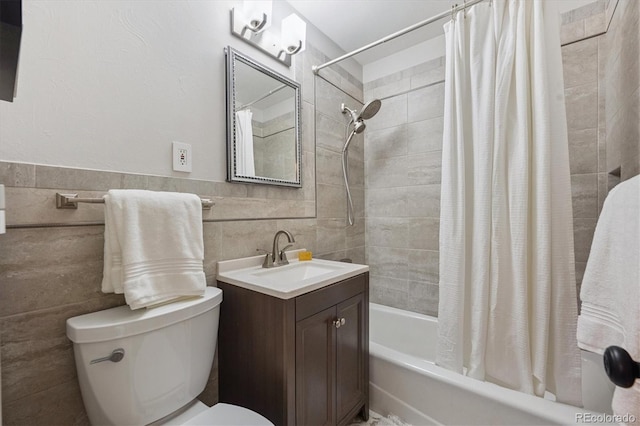 3384 W Arlington Ave, Littleton, CO 80123 - bathroom featuring shower / bath combo, vanity, and tile walls