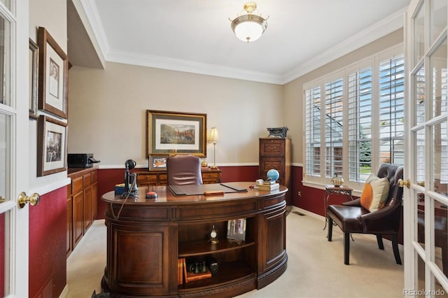 carpeted home office featuring crown molding