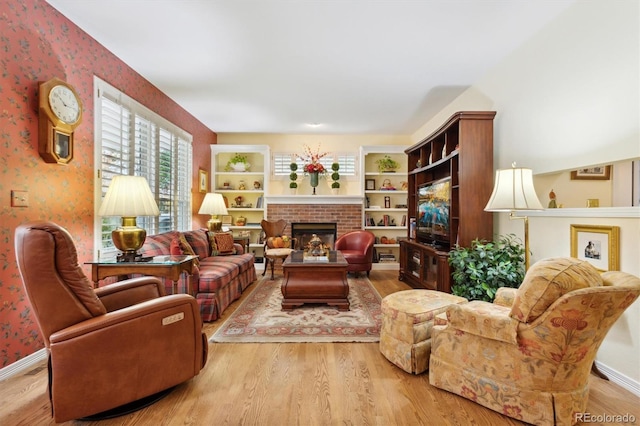 living room featuring hardwood / wood-style floors and a fireplace