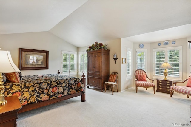 bedroom with multiple windows, light colored carpet, and lofted ceiling