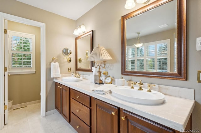 bathroom featuring vanity, tile patterned floors, and a wealth of natural light