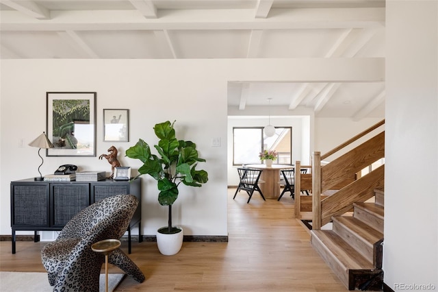 interior space with beamed ceiling and hardwood / wood-style flooring