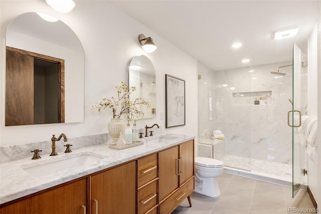 bathroom featuring vanity, toilet, and walk in shower