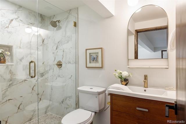 bathroom with vanity, toilet, and walk in shower