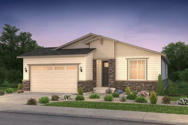 view of front of house with driveway, an attached garage, and stone siding