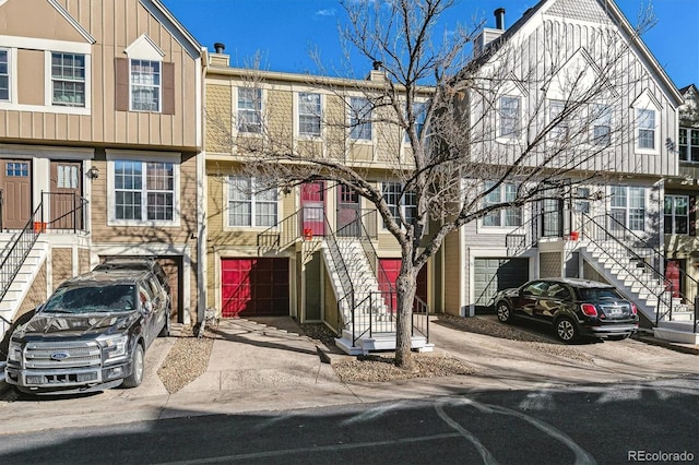 townhome / multi-family property featuring a garage