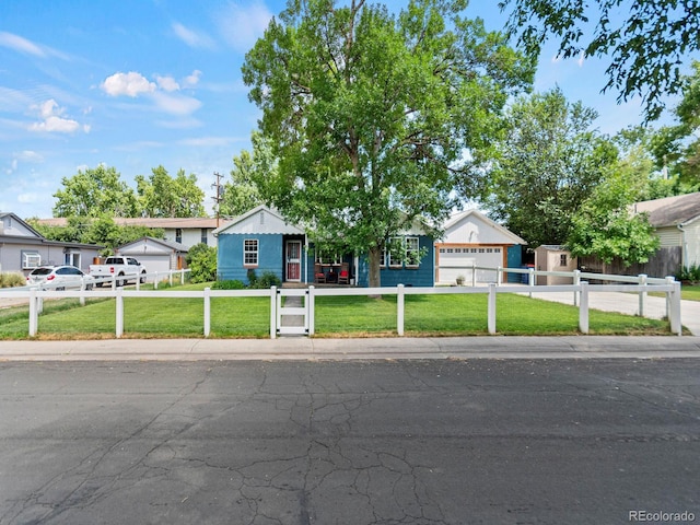 4540 Yarrow St, Wheat Ridge, CO 80033 - ranch-style house with a fenced front yard, a garage, and concrete driveway