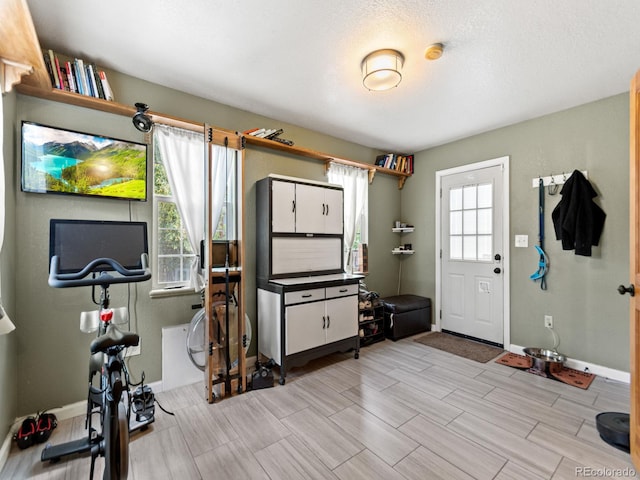 4540 Yarrow St, Wheat Ridge, CO 80033 - exercise room with wood tiled floors and baseboards