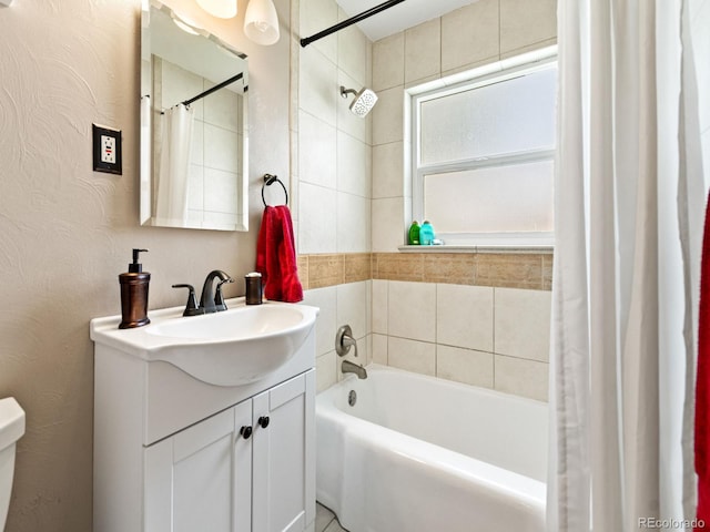 4540 Yarrow St, Wheat Ridge, CO 80033 - bathroom with vanity, shower / bath combo with shower curtain, and a textured wall